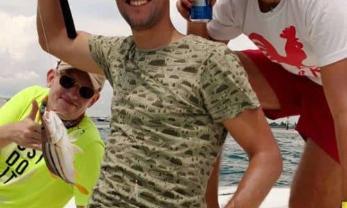 Boys Having Fun With Boat Fishing