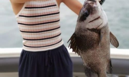 Child Caught Fish During Fishing Trip