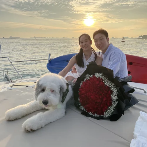 Customer02 with old english sheepdog. Dog friendly packages for dog cruise provided by Wanderlust Adventure best Singapore yacht rental.