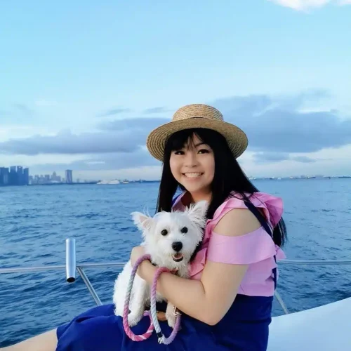 Customer11 with west highland white terrier. Dog friendly packages for dog cruise provided by Wanderlust Adventure best Singapore yacht rental.