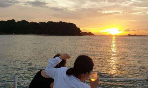 Family Looking at Sunset at BBQ Yacht Rental