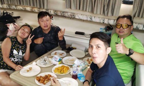 Taking Photo While Enjoying Lunch In Yacht